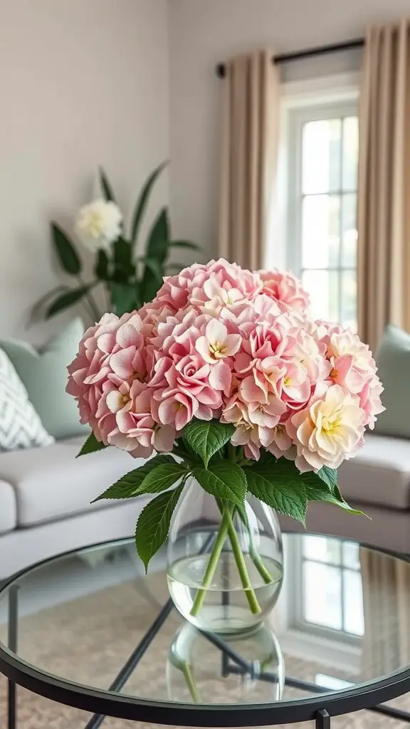 A bouquet of pink and white hydrangeas in a clear vase on a coffee table in a cozy living room.