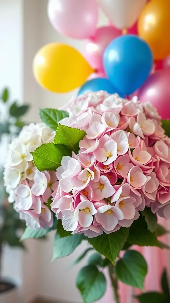 A bouquet of pink and white hydrangeas with colorful balloons in the background.